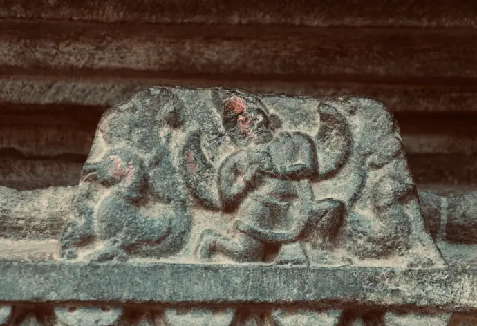 a stone carving of an elephant on a wall