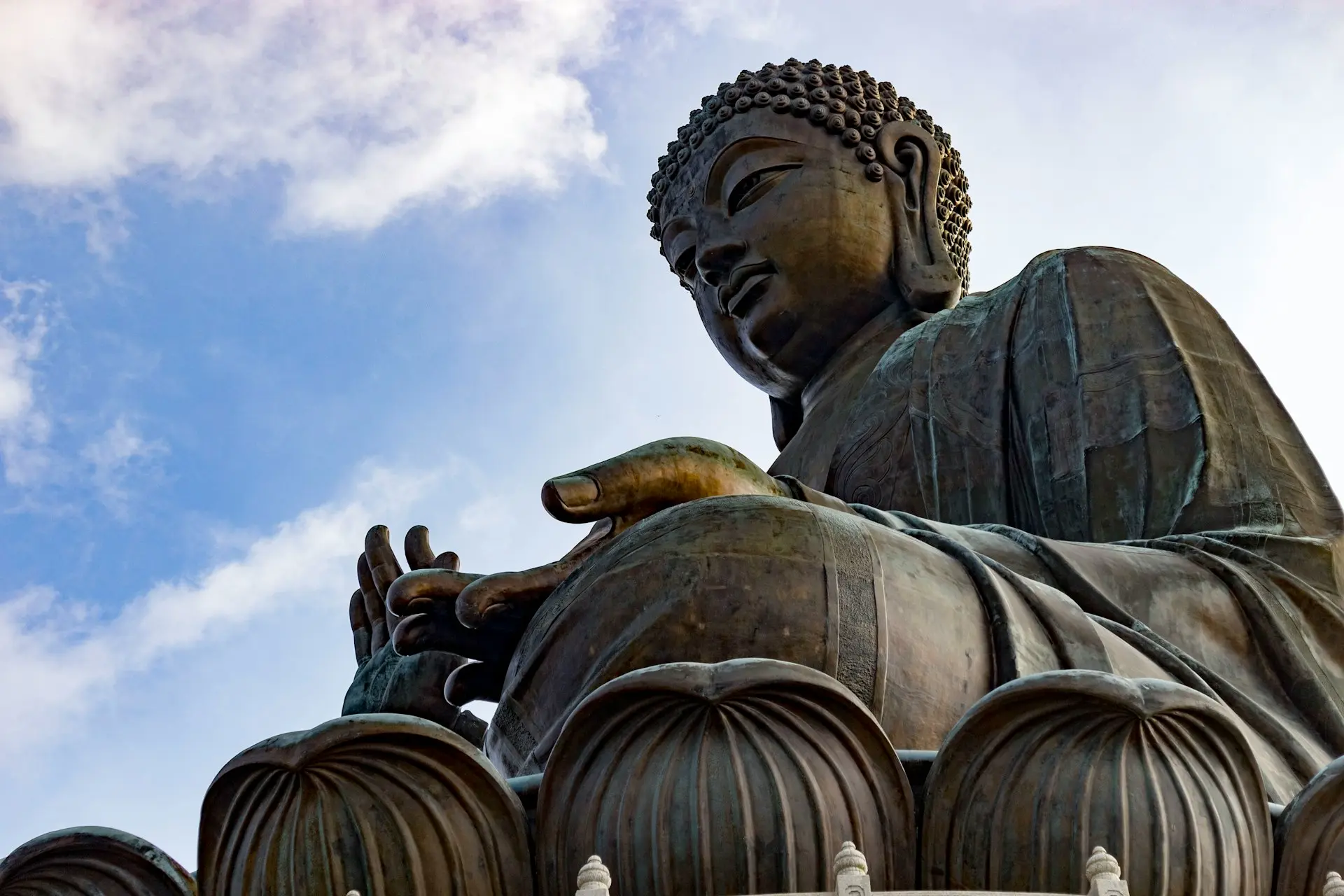 brown concrete statue under blue sky during daytime