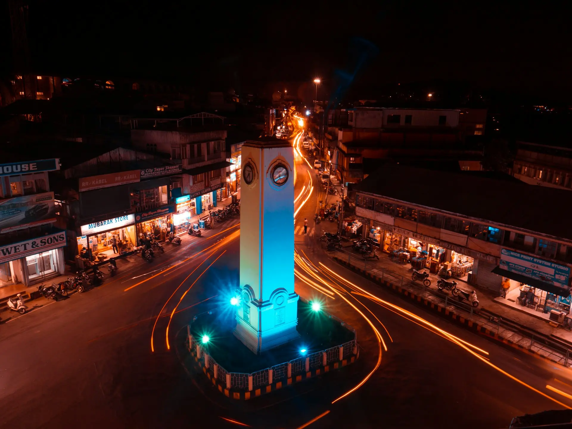Night view of a lit-up clock tower in Andaman, India—an exotic destination for family holiday packages abroad and all-inclusive foreign tours.