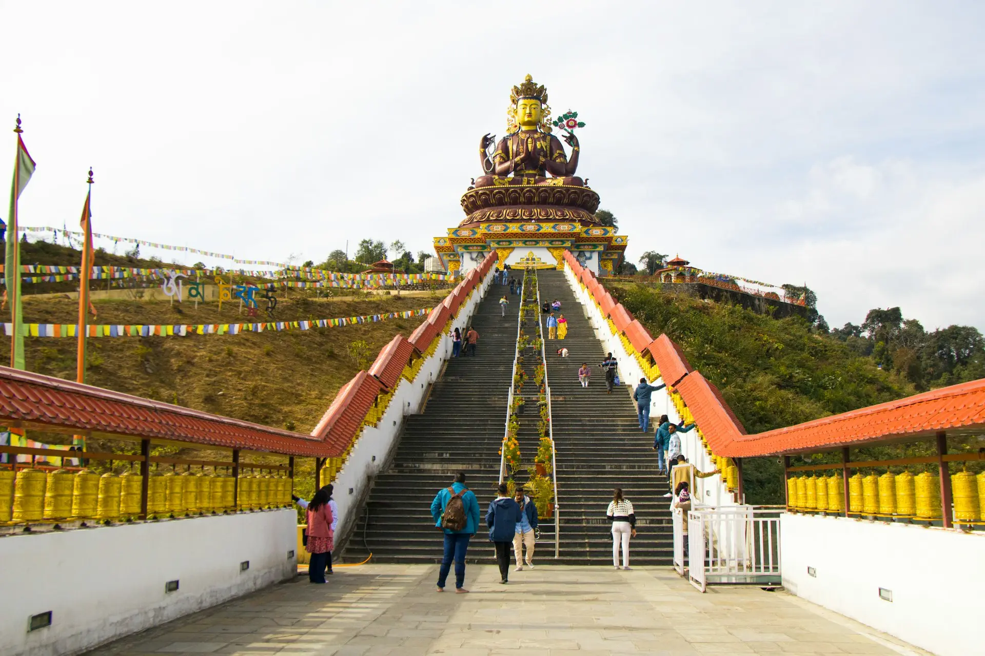 A group of people walking across a bridge