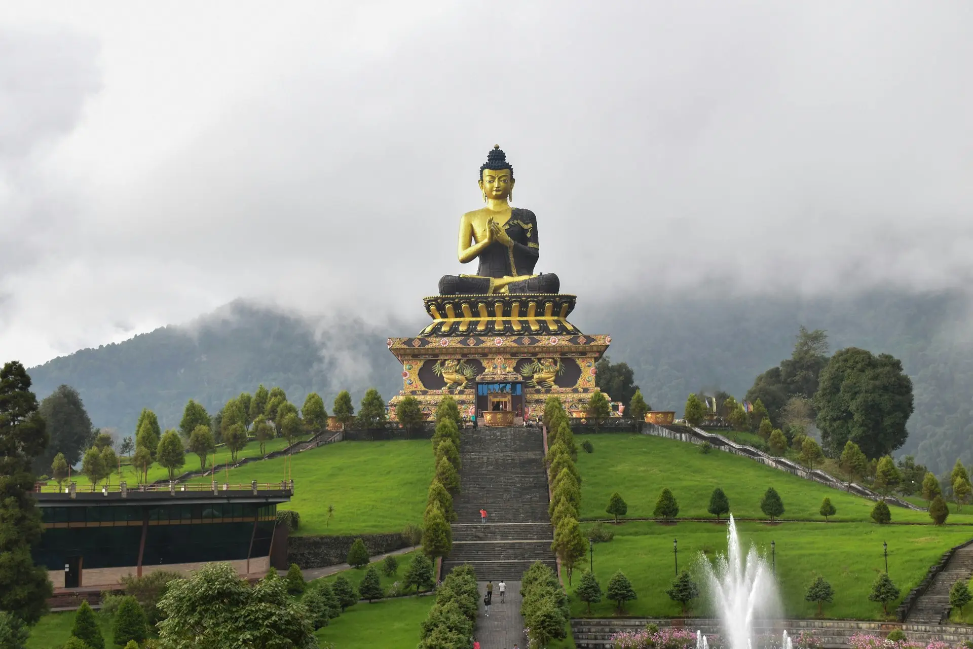 Educational tour to Sikkim featuring a majestic Buddha statue—ideal for international travel for students and custom travel packages from India.