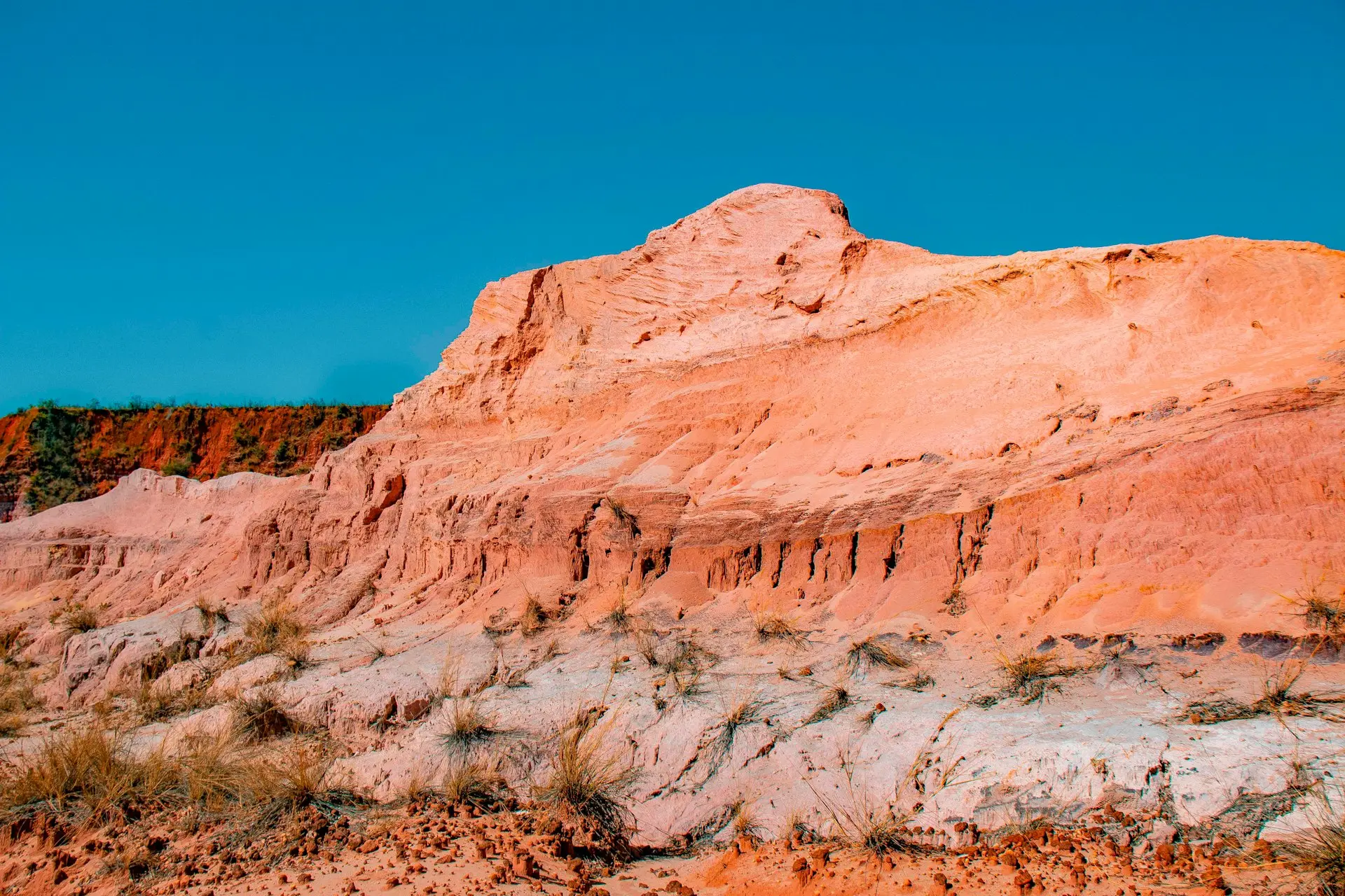 brown rocky mountain under blue sky during daytime