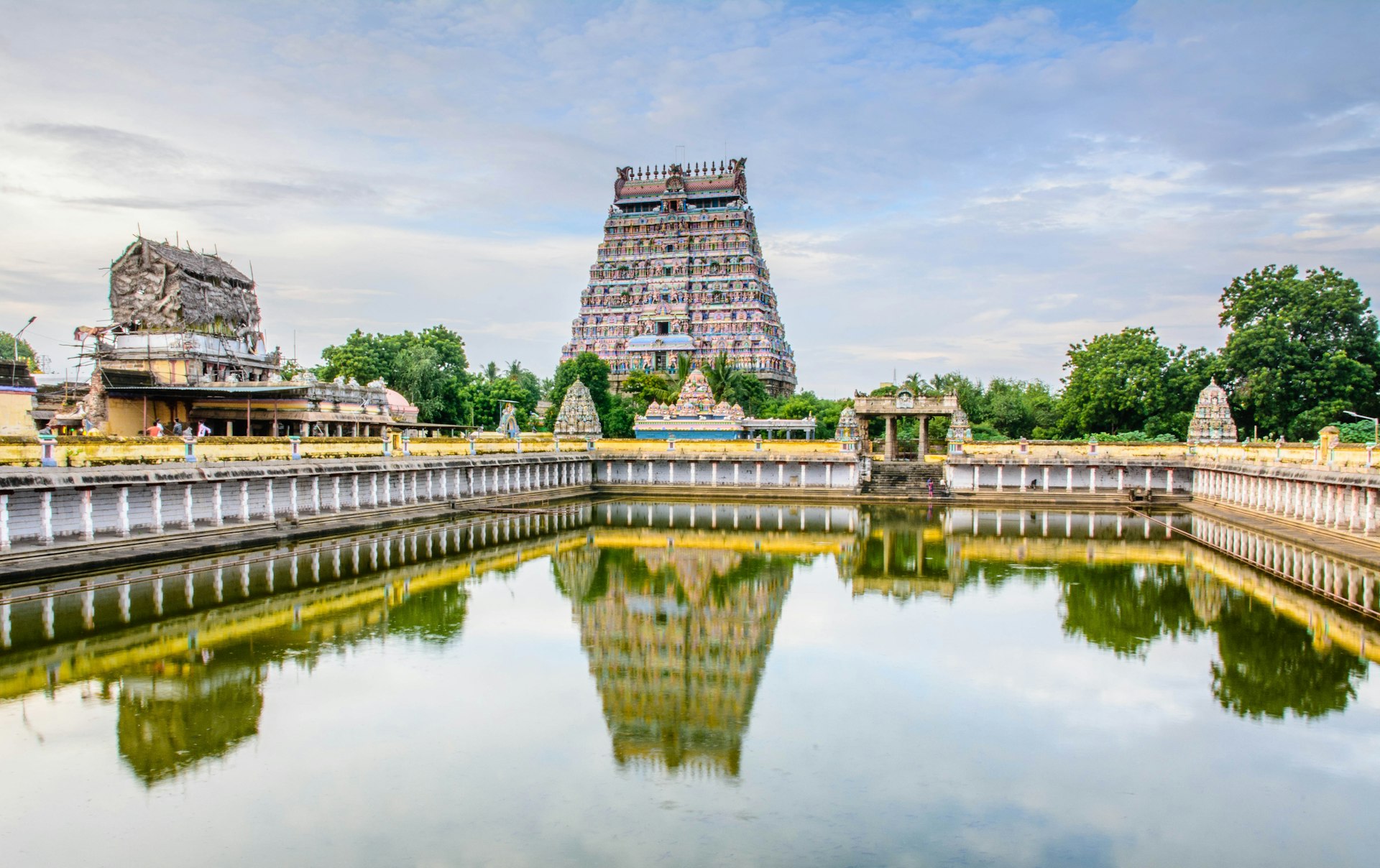 Famous South Indian temple architecture reflected in a sacred tank—perfect for pilgrimage tours from India and custom spiritual holiday packages.