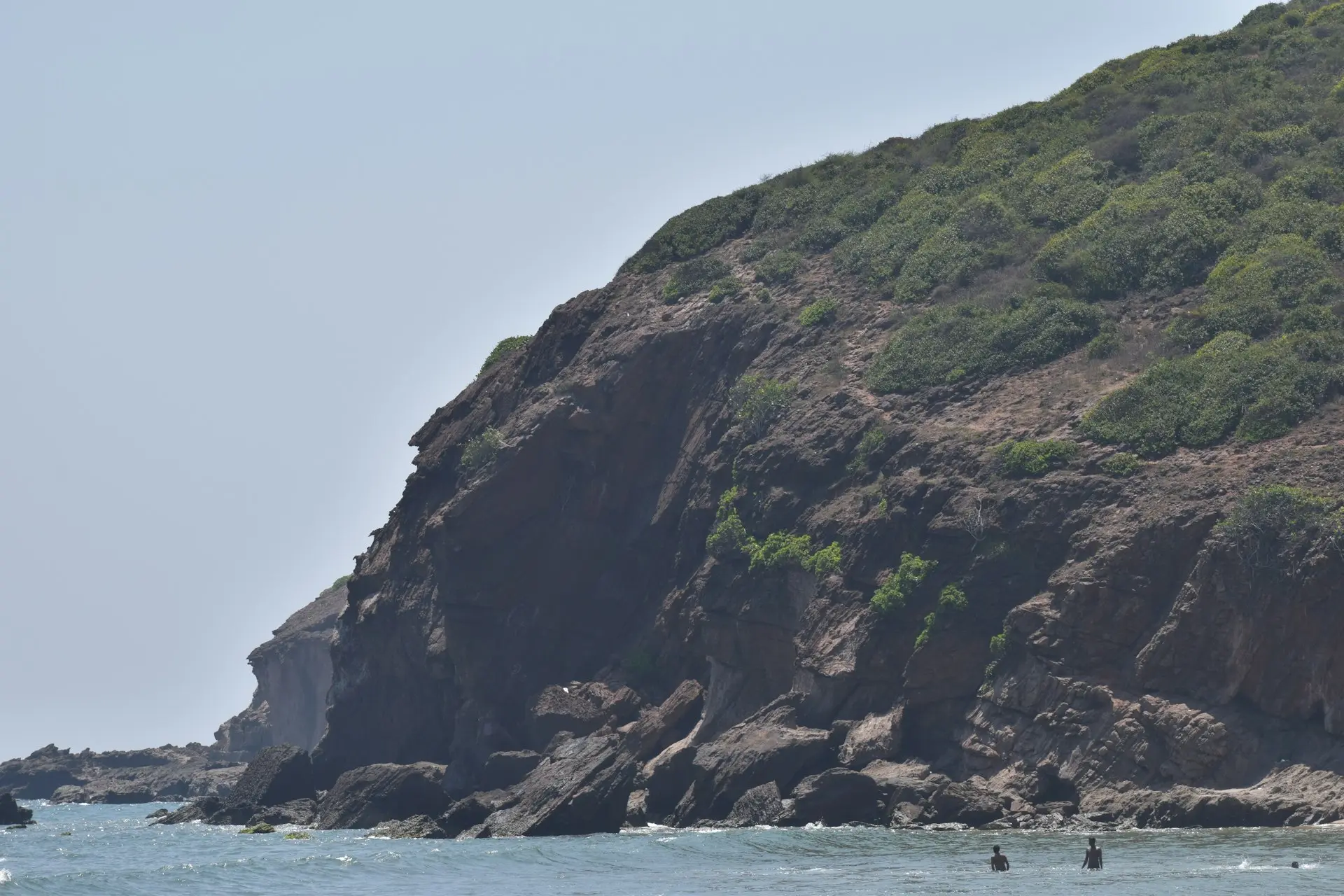 a group of people riding on top of a boat in the ocean